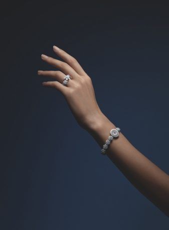 High Jewelry watches collection, watch, yellow gold, diamonds, sapphire, hand holding watch in palm, Van Cleef & Arpels